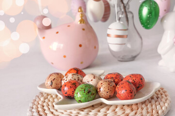 Easter holiday decorations with chocolate eggs and easter eggs decor on wooden table