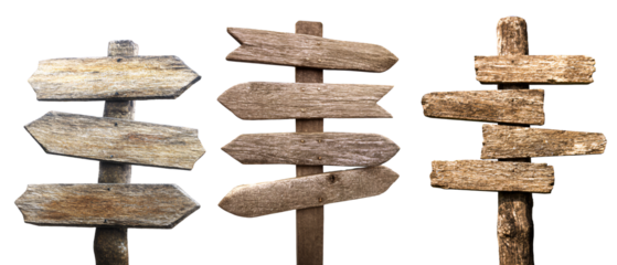 Set of weathered wooden signposts in sand, cut out