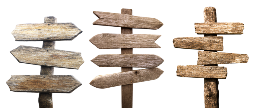 Set of weathered wooden signposts in sand, cut out