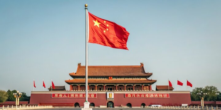 Flag of China waves at Tiananmen Square during a clear afternoon in Beijing showcasing cultural significance