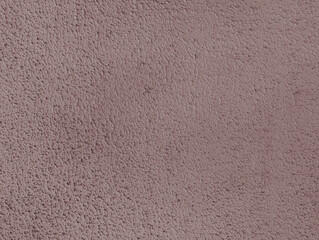 Pale purple mauve paint wall texture or background with gotele, grainy, textured, , scratched, rough and scratchy effect for typical Mediterranean house, chalet and villa exteriors in Spain.