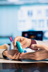 Healthcare professional checking diabetic patient glucose levels using diagnostic tools. Indian doctor offers medical advice for managing blood sugar control, expert care in modern office. Close up.