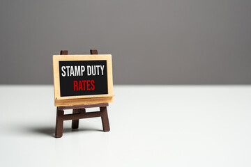Stamp duty rates on the sign board. Navigating property transactions in real estate market. Taxes...