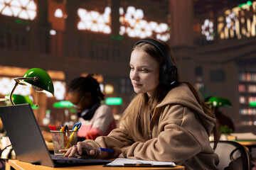 College student paying attention during remote lesson live event via video call meeting, takes...