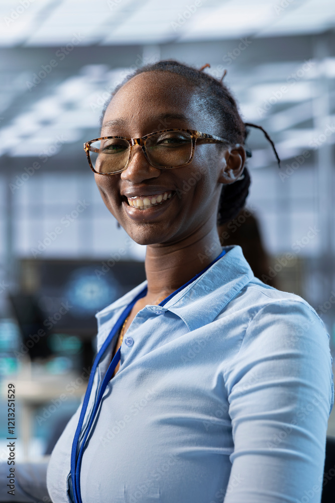 Poster portrait of happy african american computer scientist programming in ai data center used for machine