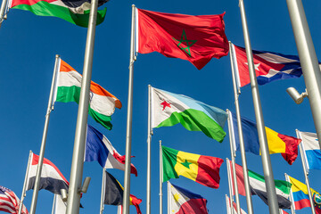 Many world's countries national flags waving on the wind, with Djibouti, Morocco and Senegal banners in the foreground, Doha, Qatar