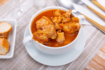 Popular dish of Spanish cuisine is Manos de cerdo, made from pork legs with tomato sauce and pepper