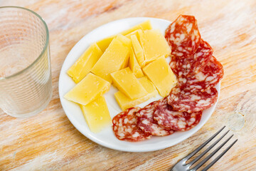 Delicious cold cuts from Spanish sausages and cheeses on serving plate