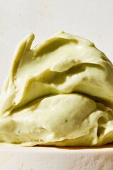 Creamy avocado guacamole close-up with smooth texture and vibrant green color