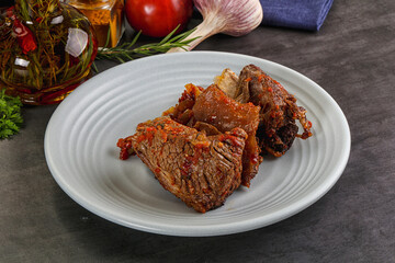 Baked beef ribs with vegetables