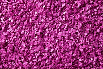 Obraz premium Small heart-shaped sprinkles in vibrant purple color create a textured background, perfect for valentine's day or romantic projects