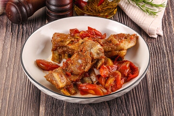 Baked lamb ribs with vegetables
