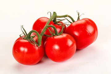 Ripe fresh tomato on the branch