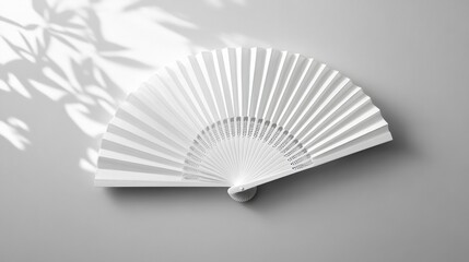 Elegant White Folding Hand Fan in Modern Art Deco Style Isolated on White Background