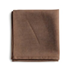 Fototapeta premium A brown cloth placed on a white background, creating a simple yet contrasting and elegant visual.