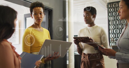 Image of financial data processing over diverse business people in office