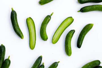 Mini cucumbers on white background.