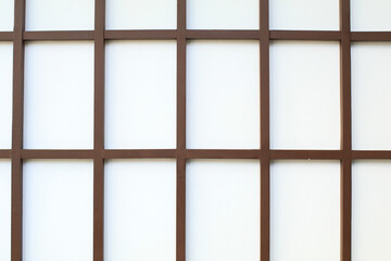 Japanese traditional wooden grid wall. Interior or exterior design door or window.
