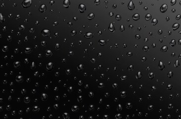 Obraz premium Black background with water droplets of various sizes.
