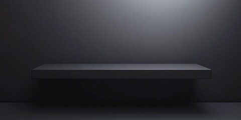 Obraz premium Dark grey shelf against a dark wall background.