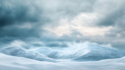 Snow covered mountains under a stormy sky