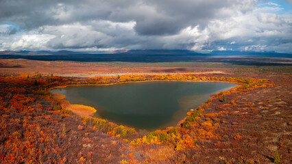 Scenic landscape of pond in the middle of Tundra in Northern Alaska.