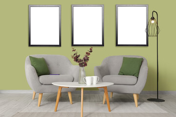 Interior of living room with mirror, grey armchairs and table
