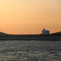 Lone church on Greek Island at Sunset