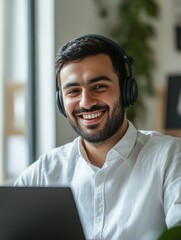 Fototapeta premium Smiling Professional with Headphones at Work