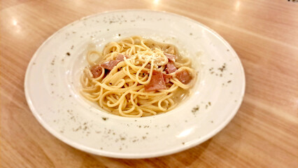 Spaghetti Carbonara on wooden background