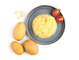 Plate of tasty mashed potatoes with tomato and garlic on white background