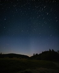 Starry Night Sky Above Serene Landscape with Forest and Hills