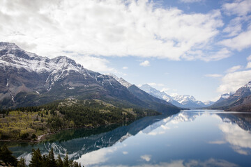 Fototapeta premium Gorgeous reflection of snowy mountains in Waterton Lake national park
