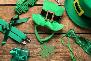 Leprechaun hats with suspenders, plastic eyeglasses and decor on wooden background. St. Patrick's...