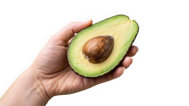 A hand holding a fresh, ripe avocado halved to reveal its smooth, creamy flesh and seed, highlighting its vibrant green color.