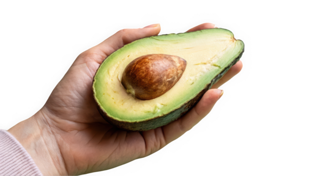 A hand holding a ripe avocado half, showcasing its creamy texture and large pit, symbolizing healthy eating.
