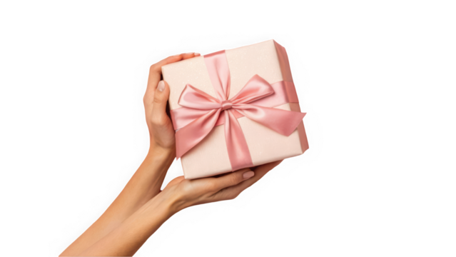Elegant hands holding a beautifully wrapped gift box with a pink satin ribbon.