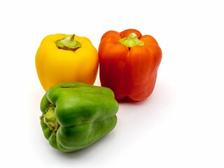 Colorful bell peppers on white background.