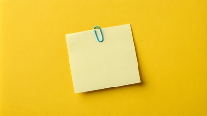 Yellow Sticky Note with Blue Binder Clip on Yellow Background, Minimalist Composition,Blank Note,Reminder Notepad, Stationery