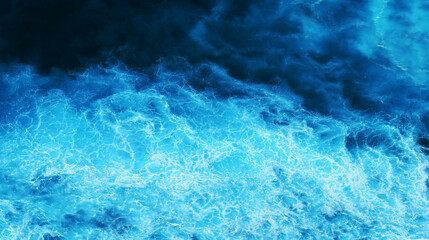 Turquoise ocean sea water white wave splashing deep blue sea. Bird eye view monster wave splash on rock. Tropical sea beach in summer seaside outdoor. Ocean island beautiful dramatic landscape.