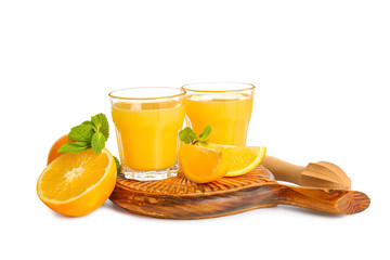 Glasses of fresh orange juice with mint and fruits on white background