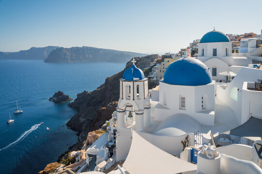 Blue dome church and white town, Oia, Santorini island, Greece