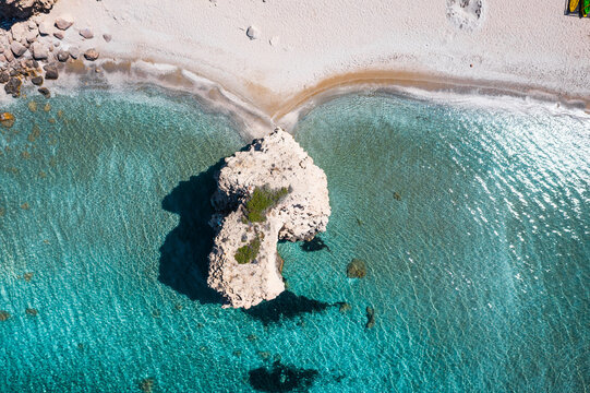 Aerial view of sandy beach with rock, Milos island, Greece