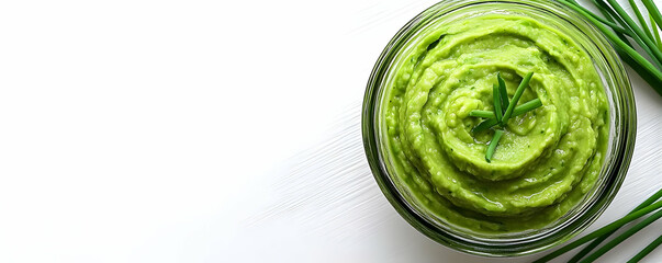 Green dip in glass jar, white background