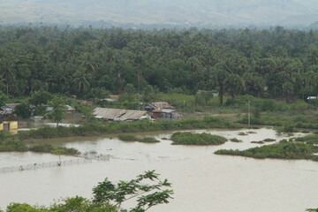 East Sumba, East Nusa Tenggara, Indonesia –  04. 07. 2021 – Cyclone Seroja caused heavy flooding, destroyed the dam, submerged houses, and toppled large trees in Waingapu