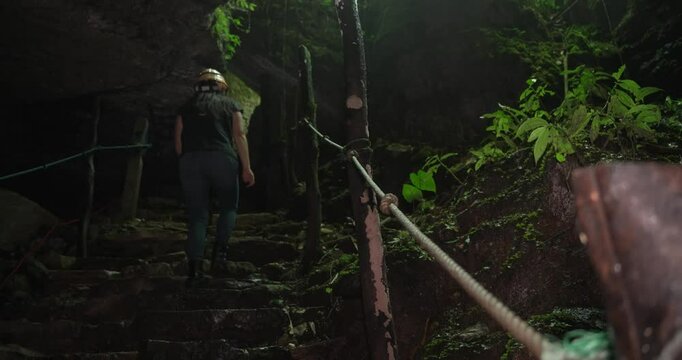 A woman exits a cave in Cuetzalan, Puebla, Mexico.