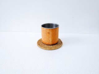 handicrafts from leftover wood in the form of glasses and cups. Aesthetic wooden glasses are suitable for cafes, restaurants and homes. on a white background