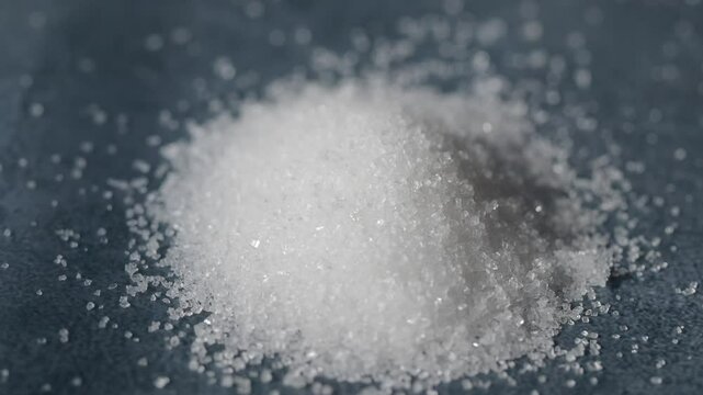 Pile of granulated sugar on table 