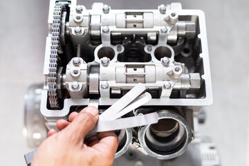 Fix valve clearance, Setting valve clearance using a feeler gauge to measure clearance to replace valve shims to the correct clearance.
