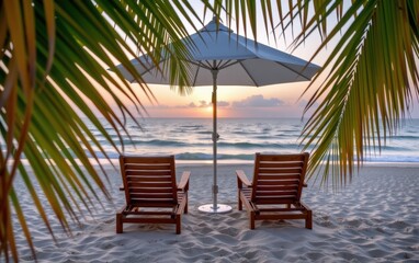 A tranquil beach scene at sunrise with two wooden lounge chairs positioned under a white umbrella.